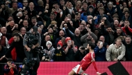 Manchester United's Portuguese midfielder #08 Bruno Fernandes celebrates scoring the team's first goal during the English Premier League football match between Manchester United and Chelsea at Old Trafford in Manchester, north west England, on November 3, 2024. (Photo by Paul Ellis / AFP) 