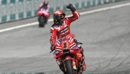 Ducati Lenovo Team’s Italian rider Francesco Bagnaia celebrates as he crosses the finish line to win the MotoGP Malaysian Grand Prix.