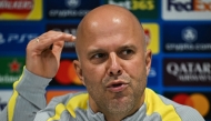 Liverpool's Dutch manager Arne Slot gestures as he speaks during a press conference, at the Anfield stadium, in Liverpool, north west England, on November 4, 2024, on the eve of their UEFA Champions League football match against Bayer Leverkusen. (Photo by Paul ELLIS / AFP)
