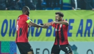 Al Rayyan’s Hazem Shehata (right) celebrates with captain Abdulaziz Hatem after scoring the goal.