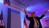 A man in a Trump mask greets the Catawba County Republicans at a watch party on November 5, 2024 in Newton, North Carolina. Melissa Sue Gerrits/Getty Images/AFP 