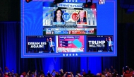 Supporters of former US President and Republican presidential candidate Donald Trump take pictures of a screen during an election night event at the West Palm Beach Convention Center in West Palm Beach, Florida, early on November 6, 2024. (Photo by Jim Watson / AFP)
 