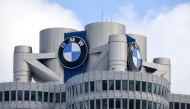 The BMW logo is seen on the top of the headquarters of German carmaker BMW in Munich on March 20, 2018. Photo by CHRISTOF STACHE / AFP