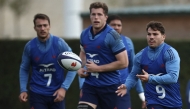 France's scrum-half and captain Antoine Dupont (R) attends a training session in Marcoussis, south of Paris, on November 06, 2024, as part of the preparation for the Autumn international rugby union match between France and Japan. (Photo by Anne-Christine POUJOULAT / AFP)
