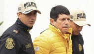 Picture distributed by the Peruvian national news agency Andina of Agustin Lozano (C), President of the Peruvian Football Federation (FPF), being arrested in Lima on November 7, 2024. (Photo by Jhonel RODRIGUEZ / ANDINA / AFP)
