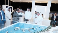 Minister of Transport H E Jassim Saif Ahmed Al Sulaiti (first right) being briefed about the Water Taxi project, during his visit to Qatar Boat Show.