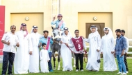 The connections of Fuwayrit (IRE) celebrate after winning the Purebred Arabian Maiden Plate, 4YOs at the second Al Rayyan Race Meeting - Sealine Cup (Div1), yesterday. Pictures: Juhaim/QREC
