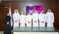 Qatar Basketball Federation President Mohammed bin Saad Al Mughaiseeb  (third right) poses for a photo with other officials during the General Assembly meeting held yesterday.