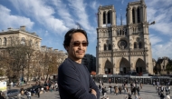 Japanese organ builder Itaru Sekiguchi, currently working on the harmonisation of the Cathedral organ, poses during a photo session in front the Notre-Dame de Paris Cathedral in Paris, on October 24, 2024. Photo by BERTRAND GUAY / AFP