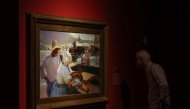 A man watches a painting by Joaquin Sorolla at the exhibition of Juan Antonio Perez Simon private collection in Madrid's Cibeles Palace, on September 26, 2024. (Photo by Pierre-Philippe Marcou / AFP) 