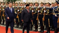 Chinese President Xi Jinping (L) and Indonesian President Prabowo Subianto review the honour guard during a welcome ceremony at the Great Hall of the People in Beijing on November 9, 2024. (Photo by Florence Lo / Pool / AFP)