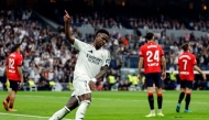 Real Madrid's Brazilian forward #07 Vinicius Junior celebrates scoring his team's first goal during the Spanish league football match between Real Madrid CF and CA Osasuna at the Santiago Bernabeu stadium in Madrid on November 9, 2024. (Photo by OSCAR DEL POZO / AFP)
