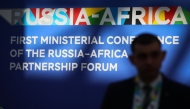 A participant walks past branding for the Russia-Africa partnership forum at Sirius University ahead of a meeting of its foreign ministers in Sochi on November 9, 2024. (Photo by STRINGER / AFP)
