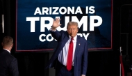 (Files) Former US President and Republican presidential candidate Donald Trump waves as he leaves after speaking during a campaign event at the Tucson Music Hall in Tucson, Arizona, September 12, 2024. (Photo by Rebecca Noble / AFP)