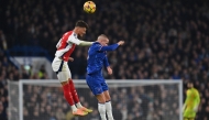 Arsenal's English defender #04 Ben White (left) vies with Chelsea's Ukrainian midfielder #10 Mykhailo Mudryk during the English Premier League football match between Chelsea and Arsenal at Stamford Bridge in London on November 10, 2024. (Photo by Glyn Kirk / AFP)