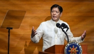 Philippine President Ferdinand Marcos delivers the annual State of the Nation Address at the House of Representatives in Manila on July 22, 2024. (Photo by JAM STA ROSA / AFP)

