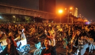 Chinese police have cracked down on an internet craze that saw thousands of cyclists throng a highway under cover of night to gorge on dumplings in a nearby city. Photo by STRINGER / AFP