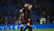 Barcelona's Polish forward #09 Robert Lewandowski (L) and Barcelona's Spanish midfielder #06 Pablo Gavi react after the Spanish league football match on November 10, 2024. (Photo by ANDER GILLENEA / AFP)