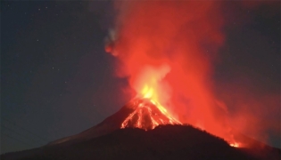 This photo provided by Indonesia's Center for Volcanology and Geological Hazard Mitigation (PVMBG) shows volcanic materials spewing from Mount Lewotobi Laki-Laki in East Flores regency of East Nusa Tenggara, Indonesia, Nov. 10, 2024. (PVMBG/Handout via Xinhua)