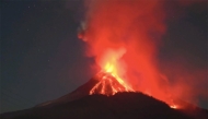 This photo provided by Indonesia's Center for Volcanology and Geological Hazard Mitigation (PVMBG) shows volcanic materials spewing from Mount Lewotobi Laki-Laki in East Flores regency of East Nusa Tenggara, Indonesia, Nov. 10, 2024. (PVMBG/Handout via Xinhua)