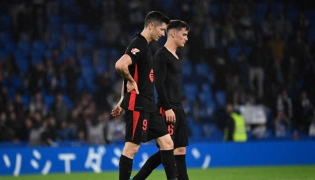 Barcelona's Polish forward #09 Robert Lewandowski (L) and Barcelona's Spanish midfielder #06 Pablo Gavi react after the Spanish league football match between Real Sociedad and FC Barcelona at the Anoeta stadium in San Sebastian on November 10, 2024. (Photo by ANDER GILLENEA / AFP)
