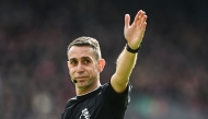 :(FILES) Referee David Coote gestures during the English Premier League football match between Liverpool and Brighton and Hove Albion at Anfield in Liverpool, north west England on March 31, 2024. (Photo by Paul ELLIS / AFP)