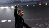 Manchester United's Dutch interim head coach Ruud van Nistelrooy acknowledges fans at the end of the English Premier League football match between Manchester United and Leicester City at Old Trafford in Manchester, north west England, on November 10, 2024. (Photo by Darren Staples / AFP)