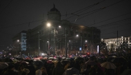 People gather in front of the Government building during a protest origanized by the opposition to demand the resignation of Prime Minister Milos Vucevic, ten days after the death of 14 people in a deadly collapse at a train station, in Belgrade on November 11, 2024. (Photo by Andrej ISAKOVIC / AFP)
