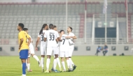 Al Khor players celebrate a goal during the match against Al Gharafa.