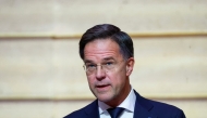 NATO Secretary General Mark Rutte delivers a statement as the French President listens on, during their meeting at The Elysee Palace, in Paris on November 12, 2024. Photo by Manon Cruz / POOL / AFP.