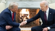 US President Joe Biden shakes hands with US President-elect Donald Trump during a meeting in the Oval Office of the White House in Washington, DC, on November 13, 2024. (Photo by SAUL LOEB / AFP)

