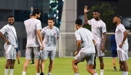 Qatar players take part in a training session ahead of the match yesterday.