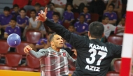 An Al Duhail player shoots at the goal to score during the match against Kazma SC.