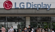 This picture taken on August 29, 2023 shows employees leaving the LG Display factory in Hai Phong. Photo by Nhac NGUYEN / AFP