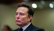 Photo used for demonstration purposes. Elon Musk listens as US President-elect Donald Trump speaks during a meeting with House Republicans at the Hyatt Regency hotel in Washington, DC on November 13, 2024. Photo by Allison ROBBERT / POOL / AFP.