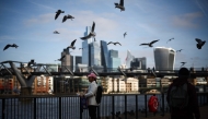 Photo used for demonstration purposes. Seagulls fly over people walking on the Southbank of the River Thames backdropped by the business and financial district in central London on November 15, 2024. Photo by HENRY NICHOLLS / AFP.