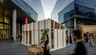 Visitors walk past a mycelium-based modular shelter, designed by the ReRoot initiative during the annual Design Week in Dubai on November 9, 2024. (Photo by Fadel Senna / AFP)