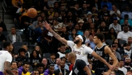 Anthony Davis #3 of the Los Angeles Lakers reaches for a pass as he is guarded by Victor Wembanyama #1 of the San Antonio Spurs in the first half the Emirates NBA Cup game at the Frost Bank Center on November 15, 2024 in San Antonio, Texas. Ronald Cortes/Getty Images/AFP 