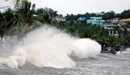 Large waves break along a seawall ahead of the expected landfall of Super Typhoon Man-yi, in Legaspi City, Albay province on November 16, 2024. (Photo by CHARISM SAYAT / AFP)
