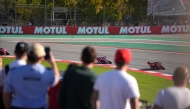 Photo used for demonstration purposes. Spectators watch as Ducati Italian rider Francesco Bagnaia (R) followed by Ducati Spanish rider Marc Marquez and Ducati Spanish rider Jorge Martin (L) compete during the MotoGP Solidarity Grand Prix of Barcelona at the Circuit de Catalunya on November 17, 2024 in Montmelo on the outskirts of Barcelona. Photo by Manaure Quintero / AFP.