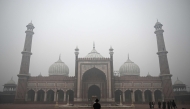 Tourists visit Jama Masjid amid thick smog, in the old quarters of Delhi on November 18, 2024. (Photo by Sajjad Hussain / AFP)