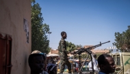 (FILES) A Sudanese army soldier mans a machine gun on top of a military pickup truck outside a hospital in Omdurman on November 2, 2024. (Photo by Amaury Falt-Brown / AFP)
