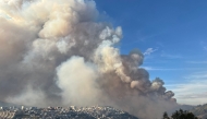 Smoke from a wildfire is seen in Quito on September 24, 2024. Photo by Galo PAGUAY / AFP

