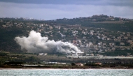 Smoke billows from the site of an Israeli strike that targeted the village of Mansouri in southern Lebanon's Tyre district on November 18, 2024. (Photo by Kawnat Haju / AFP)