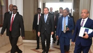 US Special Envoy for Sudan Tom Perriello (centre) is welcomed by local officials upon his arrival in Port Sudan on November 18, 2024. (Photo by AFP)