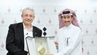 Chairman of Qatar Press Center Saad bin Mohammed Al Rumaihi (right) honouring Dr. Mustafa Barghouti at the event.