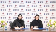 Senior Executive Vice President of Group Communication at QNB Heba Al Tamimi and Chairperson of Qatari Autism Society Sheikha Jawaher bint Fahad bin Jassim bin Jaber Al Thani during the agreement signing.