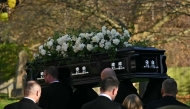 Pallbearers carry the coffin of the late One Direction singer Liam Payne, into the church ahead of his funeral service in the Home Counties, to the west of London, on November 20, 2024. Photo by JUSTIN TALLIS / AFP