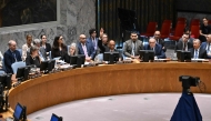 US Alternate Ambassador to the United Nations Robert Wood raises his hand to veto a draft resolution calling for a ceasefire in Gaza, during a United Nations Security Council meeting to discuss the situation in the Middle East on November 20, 2024, at UN headquarters in New York City. (Photo by Angela Weiss / AFP)