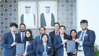 Students and school officials with the award.